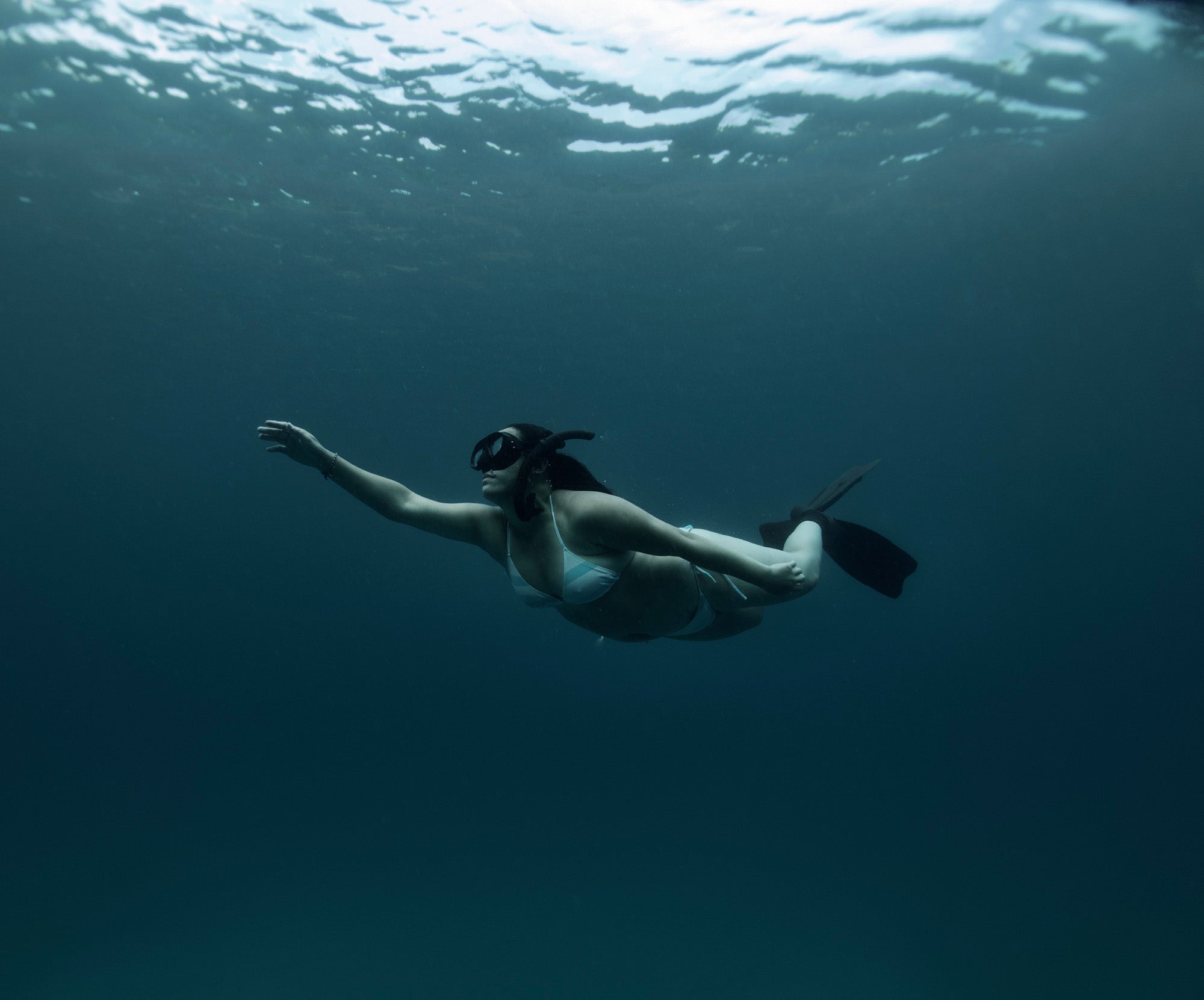 Person freediving underwater